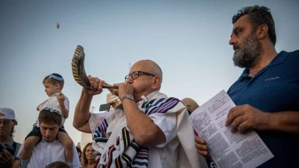 A Jewish man blows the shofar to mark the start of Rosh Hashanah (Day of Trumpets) and the High Holy Days.