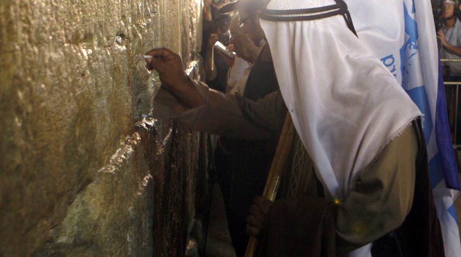 Poll: 60 Percent of Local Arabs Proud to be Israeli An Arab man prays at the Western Wall for the return of Israeli soldiers.