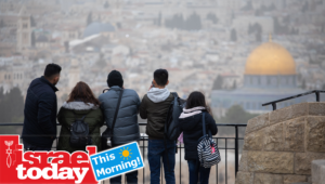 Israelis visit the Mount of Olives in Jerusalem during the winter storm.