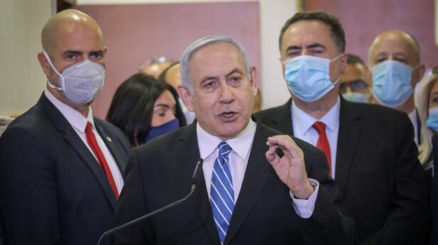 Netanyahu arrives at court for the opening of his criminal trial.