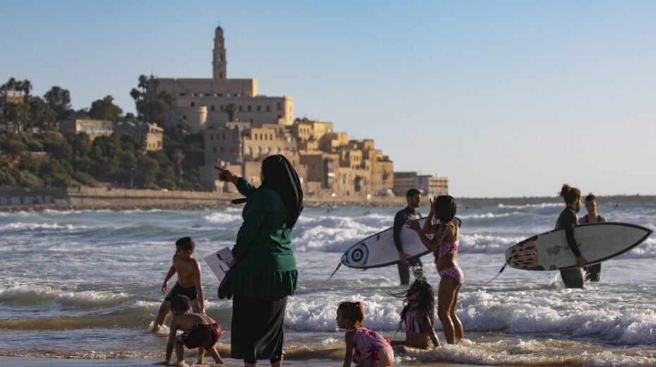 Palestinians Flood Into Israel for Weekend Leisure Palestinians enjoy a day at the beach in Tel Aviv.