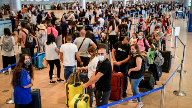The Israelis are coming! Travelers seen in the departure hall at the Ben Gurion International Airport as Israel opens the skies for outbound summer holiday travel, on July 19, 2021.