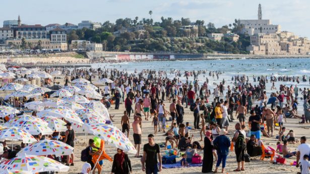 Muslims enjoy the sea by Tel Aviv during the third day of Eid al-Adha, on July 22, 2021. Muslims around the world are celebrating Eid al-Adha, the Festival of Sacrifice, to mark the end of the hajj pilgrimage.