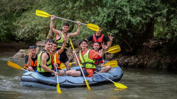 Young people enjoy kayaking in the Jordan river in Northern Israel on July 23, 2021.
