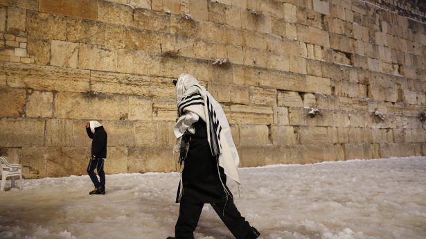 The Western Wall in Jerusalem's Old City covered in snow, January 27, 2022.