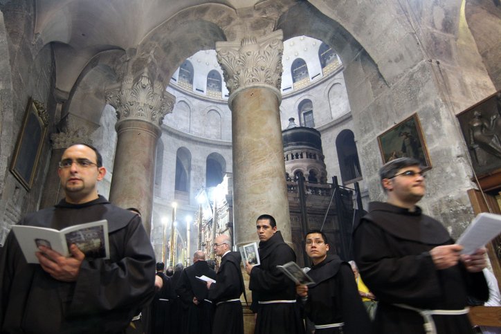 History of the Holy Sepulcher: Where Jesus was Crucified, Buried and Rose Again Fransiscan monks pray inside the Church of the Holy Sepulcher in Jerusalem's Old City.