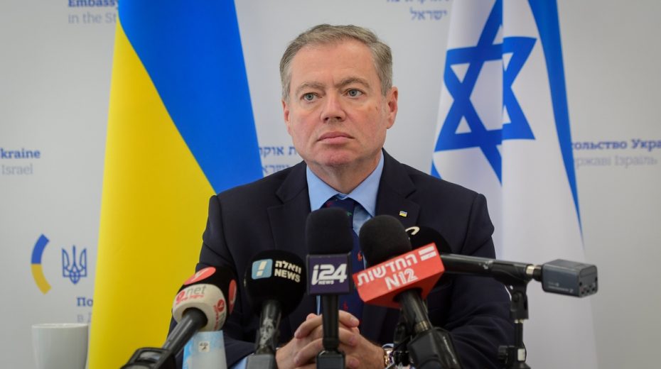 Ukraine Wants IDF Soldiers to Battle Russians Ukraine's ambassador to Israel, Yevgen Korniychuk, speaks to reporters in Tel Aviv on Friday.