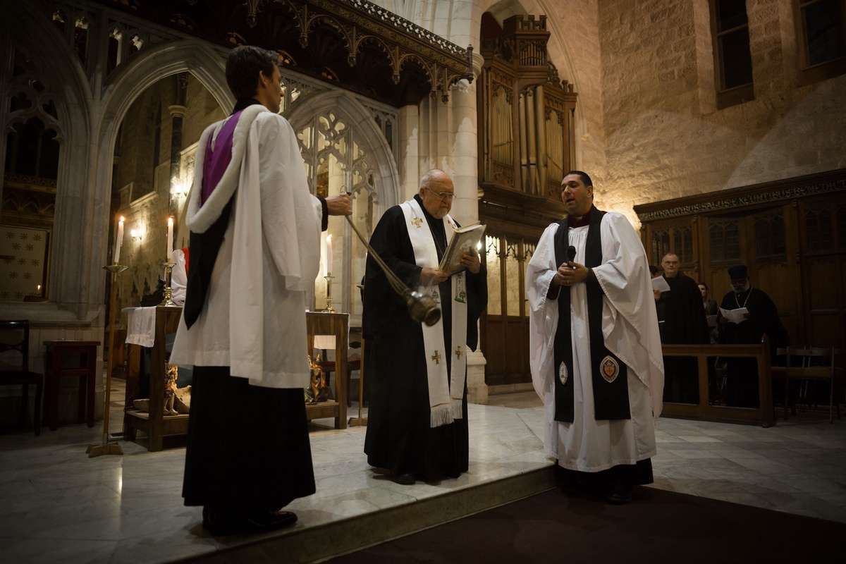 Christians pray at the Cathedral of St. George in Jerusalem.