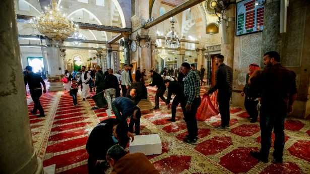 Holy site? Muslims stockpiled stones and other crude weapons inside Al Aqsa Mosque in preparation for a fight with Israeli forces.