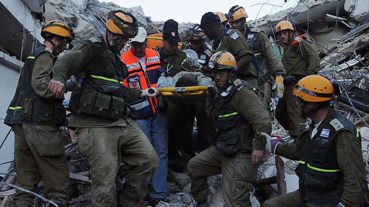Israeli search and rescue teams pull survivors from the rubble after the 2010 earthquake that devastated Haiti.
