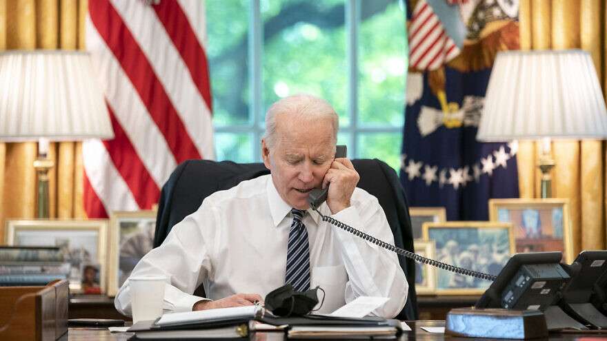 US President Joe Biden speaks on the phone with then-Israeli Prime Minister Benjamin Netanyahu on May 12, 2021, in the Oval Office of the White House.