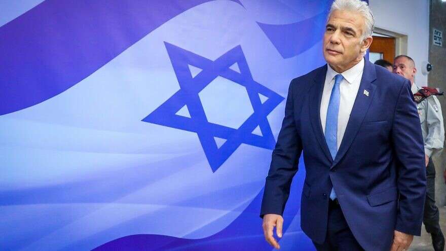 Israeli Prime Minister Yair Lapid arrives to a cabinet meeting at the Prime Minister's office in Jerusalem on July 31, 2022.