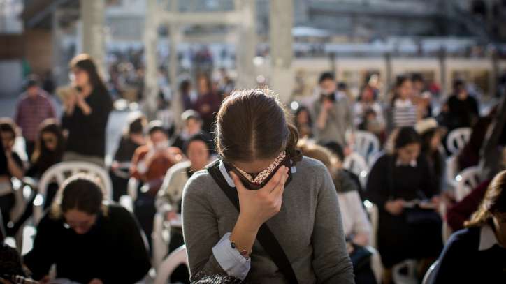Jewish worshipers at the Western Wall fervently seek the Lord's forgiveness during the Ten Days of Awe leading up to Yom Kippur, the Day of Atonement.