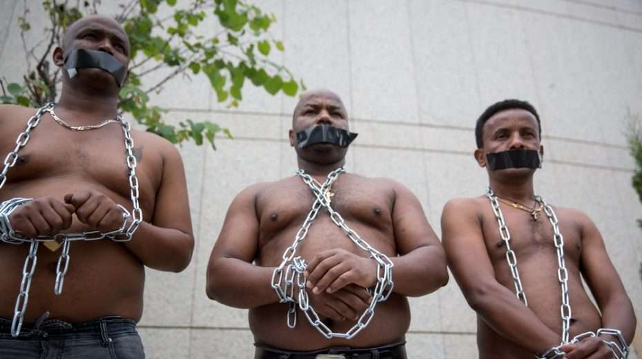 Illustration. African asylum seekers in Tel Aviv protest their deportation, arguing that they face slave-like conditions in Sudan and other countries of origin.