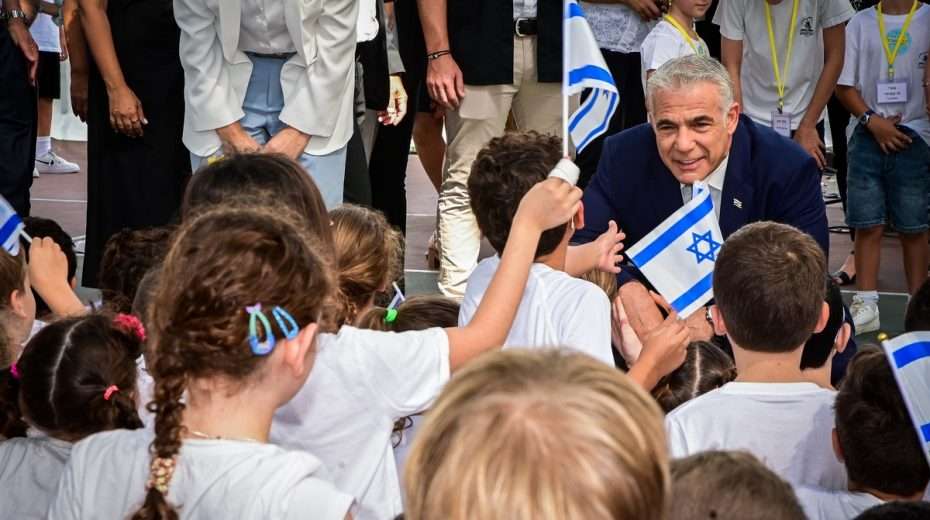 Prime Minister Yair Lapid visits Israeli children on the first day of school.