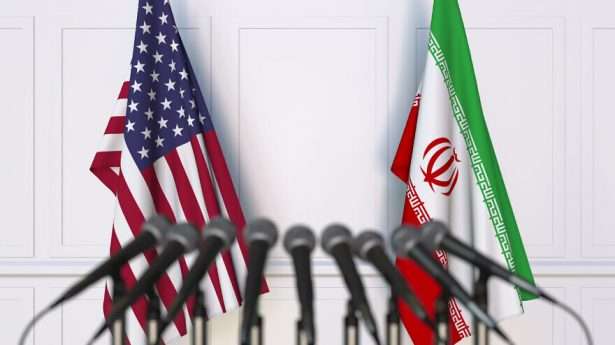The American and Iranian flags, symbolizing talks in Vienna surrounding re-entry into the Iran nuclear deal.