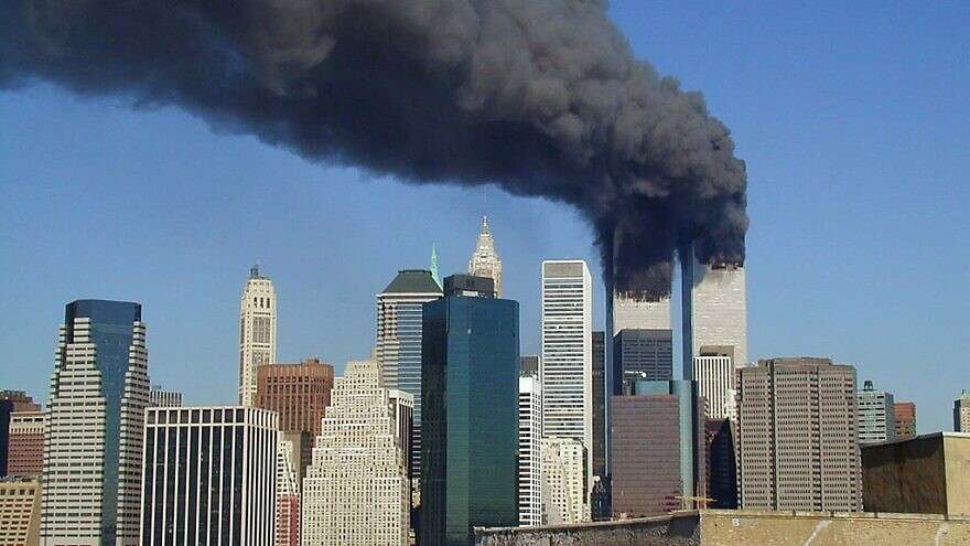 A view of the World Trade Center's Twin Towers after they were hit by Al Qaeda terrorist-flown planes, Sept. 11, 2001. Credit: Michael Foran/Wikimedia Commons.