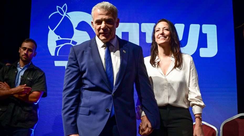 Prime Minister Yair Lapid and his wife, Lihi, at a campaign event last month. Is there a quiet connection in the family to Jesus and Messianic Judaism?