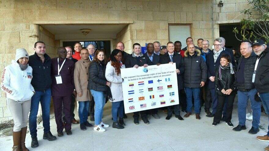 Who Are Israel’s Most Dedicated Christian Supporters? MK Yuli Edelstein (holding the sign on the right), co-chairman of the Knesset Christian Allies Caucus, and the IAF March 2022 mission to Israel. Credit: Avi Hayun/Israel Allies Foundation.