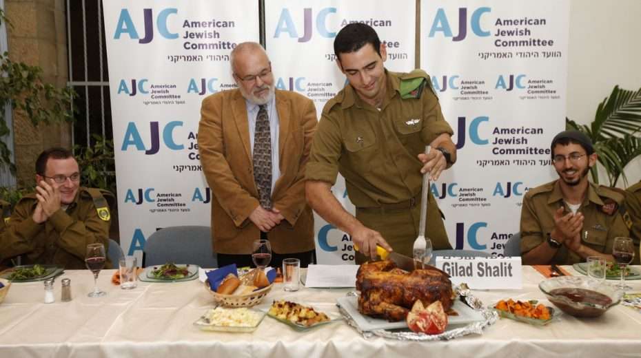 Young American-Israeli soldiers who made Aliyah without family (ie. "Lone Soldiers") are treated to a Thanksgiving meal by the American Jewish Committee.