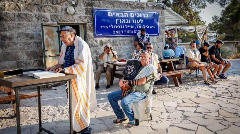 Modern Jewish "settlers" pray on ancient Jewish lands south of Jerusalem.
