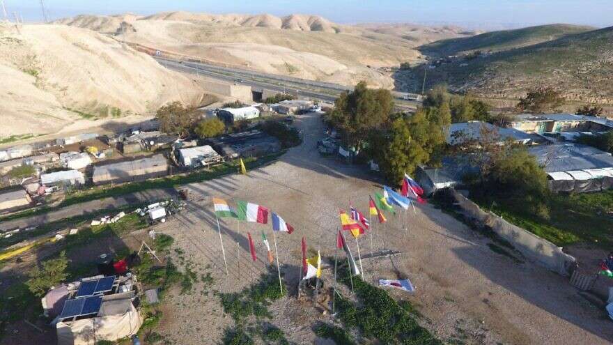 The EU-funded illegal Palestinian outpost of Khan al-Ahmar, in the E1 area east of Jerusalem, with Israel Route 1 in the background.