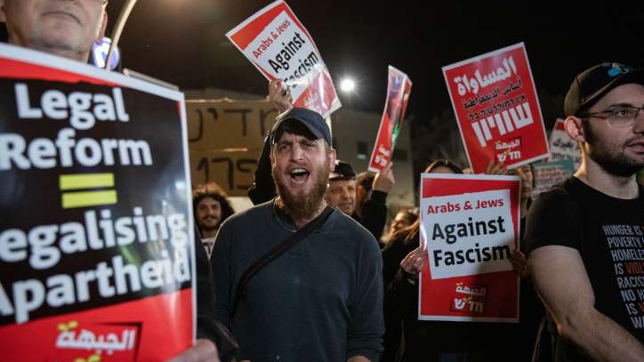 Left-wing activists protest the previous night's events in Huwara on February 27, 2023.