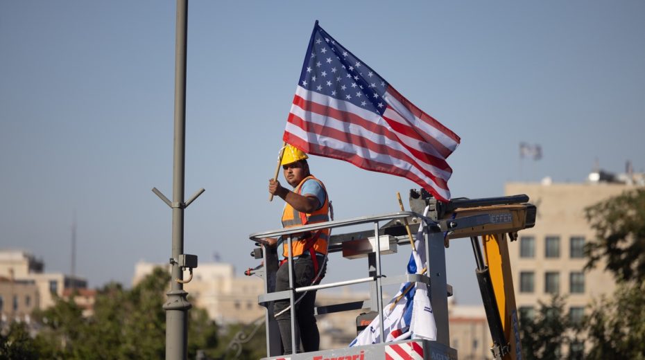 The State Department’s Problem With Israel A municipal worker hands an American flag along a major thoroughfare in Jerusalem. Photo by Yonatan Sindel/Flash90
