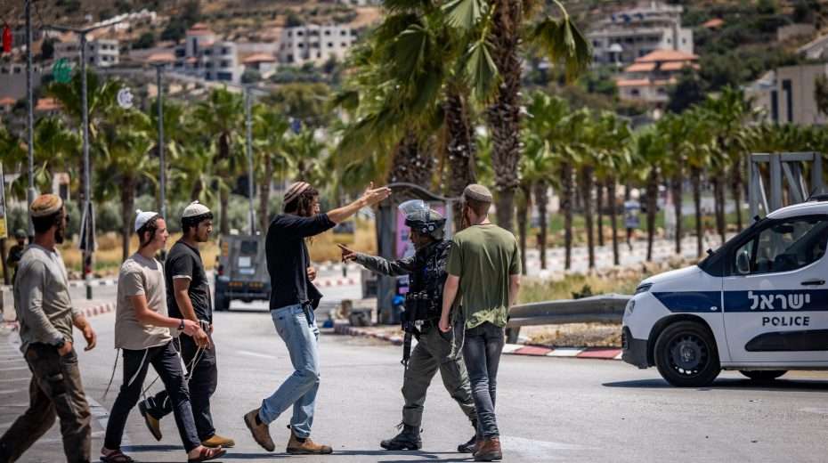 Tachles With Aviel – Is There “Jewish Terrorism”? Israeli security forces hold discussions with Jewish settlers at the entrance to the village of Turmus Aya. Photo by Yonatan Sindel/Flash90
