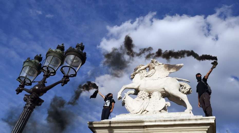 Tachles With Aviel – The Intifada in France Demonstrators hold up smoke flares during a protest in Paris to commemorate 17-year-old Nahel, who was killed by French police. Photo: EPA-EFE/MOHAMMED BADRA
