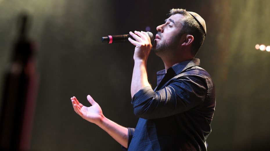 Praise anthem explodes onto secular Israeli radio Israeli singer Ishay Ribo performing live at a ceremony marking Remembrance Day for Israels fallen soldiers and victims of terror, at the Sultans Pool in Jerusalem, on May 3_ 2022. Photo by Arie Leib Abrams/Flash90