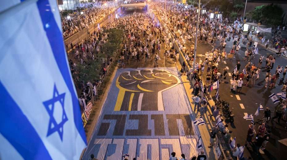 Tachles with Aviel – Does Israel need saving from a “messianic dictatorship”? Activists protest against the government's planned judicial reform on August 12, 2023 in Tel Aviv. Photo: Miriam Alster/Flash90