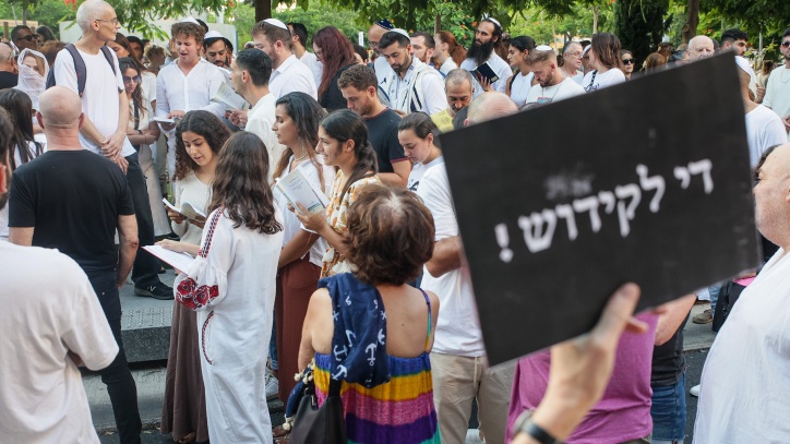 Tachles with Aviel – First we take Jerusalem, then Tel Aviv Secular liberal Israelis protest against Orthodox Jews holding a Yom Kippur prayer service in Tel Aviv. The sign reads: "Enough with sanctification." Photo by Itai Ron/Flash90
