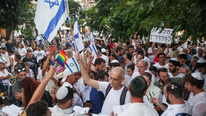 The Yom Kippur divide Jews pray while activists protest against gender segregation in the public space during a public prayer on Dizengoff Square in Tel Aviv, on Yom Kippur, the Day of Atonement, and the holiest of Jewish holidays, September 25, 2023. Photo by Itai Ron/Flash90