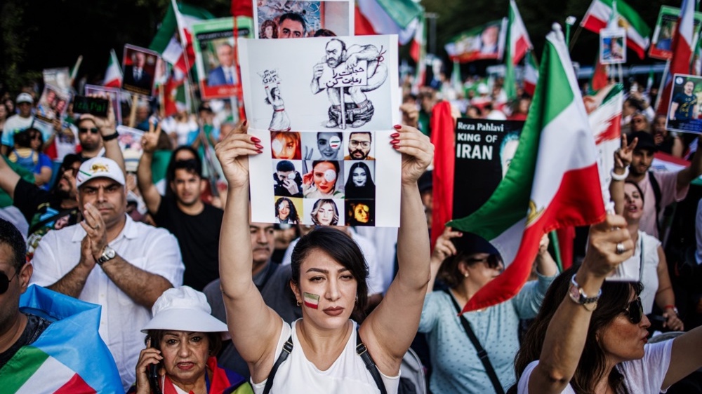 Iranians protest the brutal treatment of women by the ayatollah regime. Photo by EPA-EFE/CLEMENS BILAN