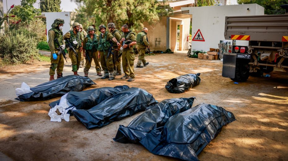 Israeli death toll from Hamas massacre rises to 1,200 as IDF pounds Gaza Israeli soldiers remove bodies of of Israeli civilians in Kibbutz Kfar Aza, near the Israeli-Gaza border, in southern Israel, October 10, 2023. Photo by Chaim Goldberg/Flash90