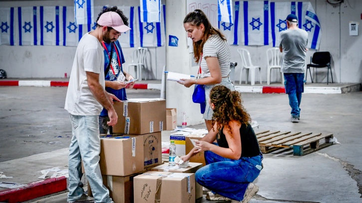 Help gird the soldiers of Israel for war Israeli volunteers pack up donated supplies for IDF soldiers. Photo by Flash90