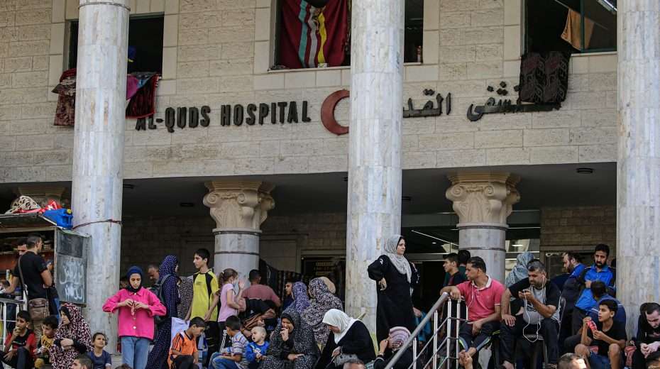 Hamas’s living props Palestinians in front of a hospital in Gaza. Image: EPA-EFE/MOHAMMED SABER