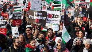 Demonstrators with placards and Palestinian flags at a pro-Palestinian demonstration in Trafalgar Square in London on November 4, 2023. Image: EPA-EFE/ANDY RAIN