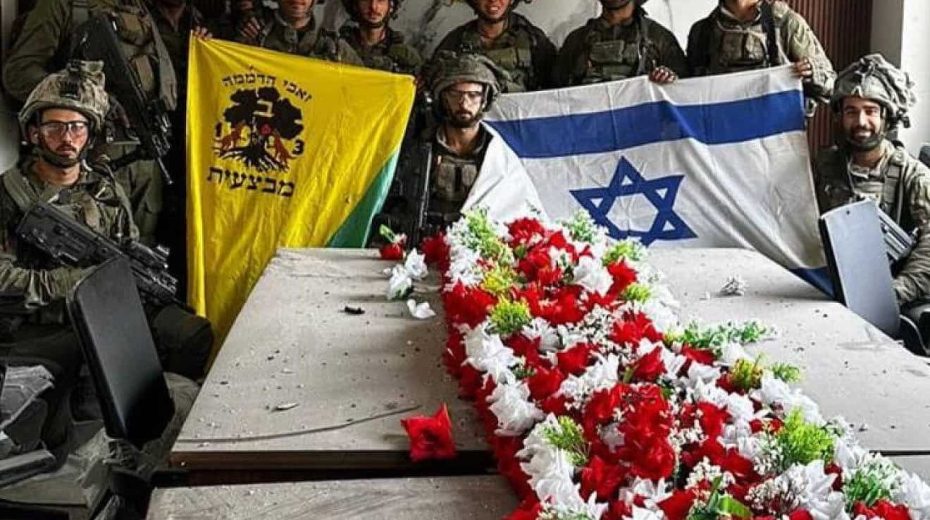 IDF soldiers fly Israeli flags across Gaza A picture circulating online shows IDF Golani Brigade soldiers displaying the Israeli flag inside Hamas’s police headquarters in the Gaza Strip, Nov. 14, 2023. Credit: Twitter.