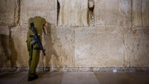 An Israeli soldier pray at the Western Wall, Judaism's holiest site, in Jerusalem's Old City, November 6, 2023. Photo by Chaim Goldberg/Flash90