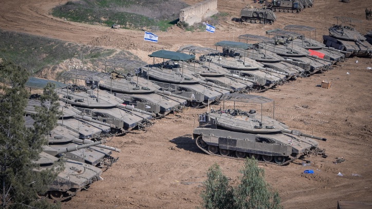 Israeli tanks seen at a staging area near the Israeli-Gaza border, southern Israel, November 30, 2023. Photo by Avshalom Sassoni/Flash90