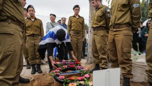 Family and friends of Israeli soldier Staff Sergeant Tuval Yaakov Tsanani mourn during his funeral in Kiryat Gat, on December 5, 2023. He was killed during a ground operation in the Gaza Strip. Photo by Flash90