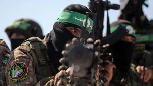 Hamas terrorists march along the border fence between Israel and the Gaza Strip, July 19, 2023. Photo by Majdi Fathi/TPS.