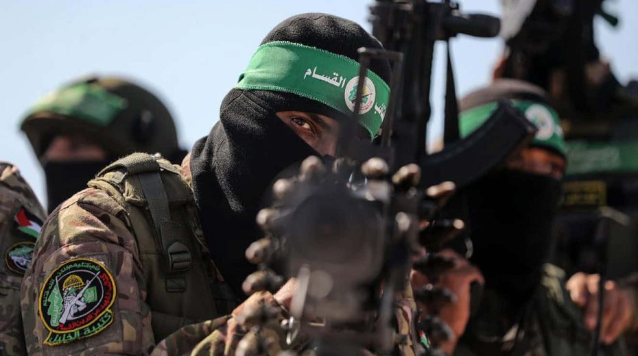 Hamas terrorists march along the border fence between Israel and the Gaza Strip, July 19, 2023. Photo by Majdi Fathi/TPS.