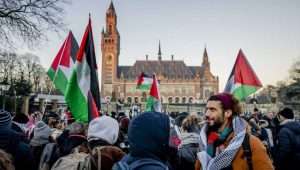 Palestinian activists gather outside the International Court of Justice (ICJ) in The Hague, Netherlands, ahead of the hearing on a suit filed by South Africa against Israel for genocide in Gaza. EPA-EFE/REMKO DE WAAL