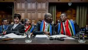 The best show in town - Ronald Lamola (C), South African Minister of Justice, and Vusimuzi Madonsela (R), South African Ambassador to the Netherlands, before the hearing of South Africa's genocide case against Israel at the International Court of Justice (ICJ) on January 11, 2024. Photo: EPA-EFE/REMKO DE WAAL