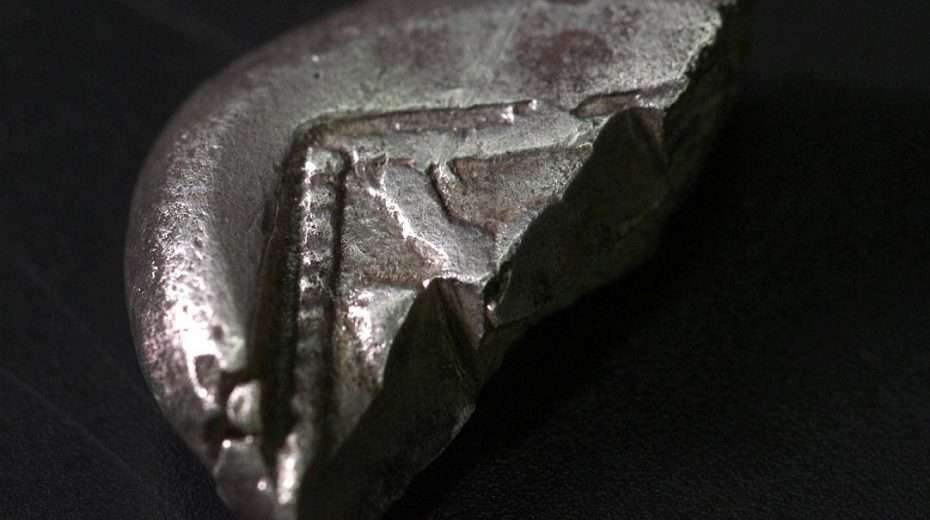 An extremely rare silver coin dated to the Persian period (6th–5th centuries BCE) is unearthed in the Judean Hills, Jan. 17, 2024. Photo by Emil Aladjem/Israel Antiquities Authority.