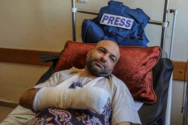 Palestinian photojournalist Ashraf Amra lying inside Nasser Medical Hospital after being hit by a gas bomb in his right hand by Israeli army soldiers near the border between Israel and Gaza, in the city of Khan Yunis, southern of Gaza Strip, on September 16, 2023. Photo by Abed Rahim Khatib/Flash90