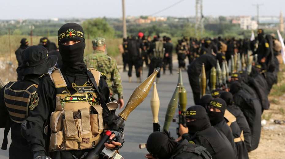 Just three days before the massacre: Members of the Al-Quds Brigades, the military wing of Islamic Jihad, hold a major military parade and unveiling of new rockets in Gaza City to mark the 36th anniversary of the group's establishment. Photo: Atia Mohammed/Flash90